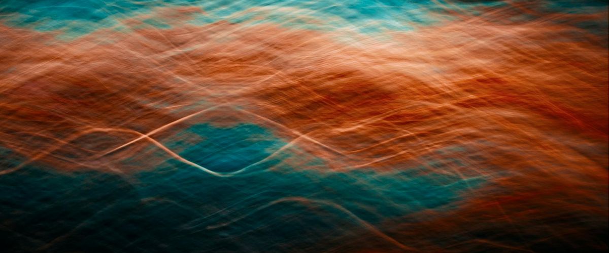 Minimalist abstract blue wave representing flow and energy